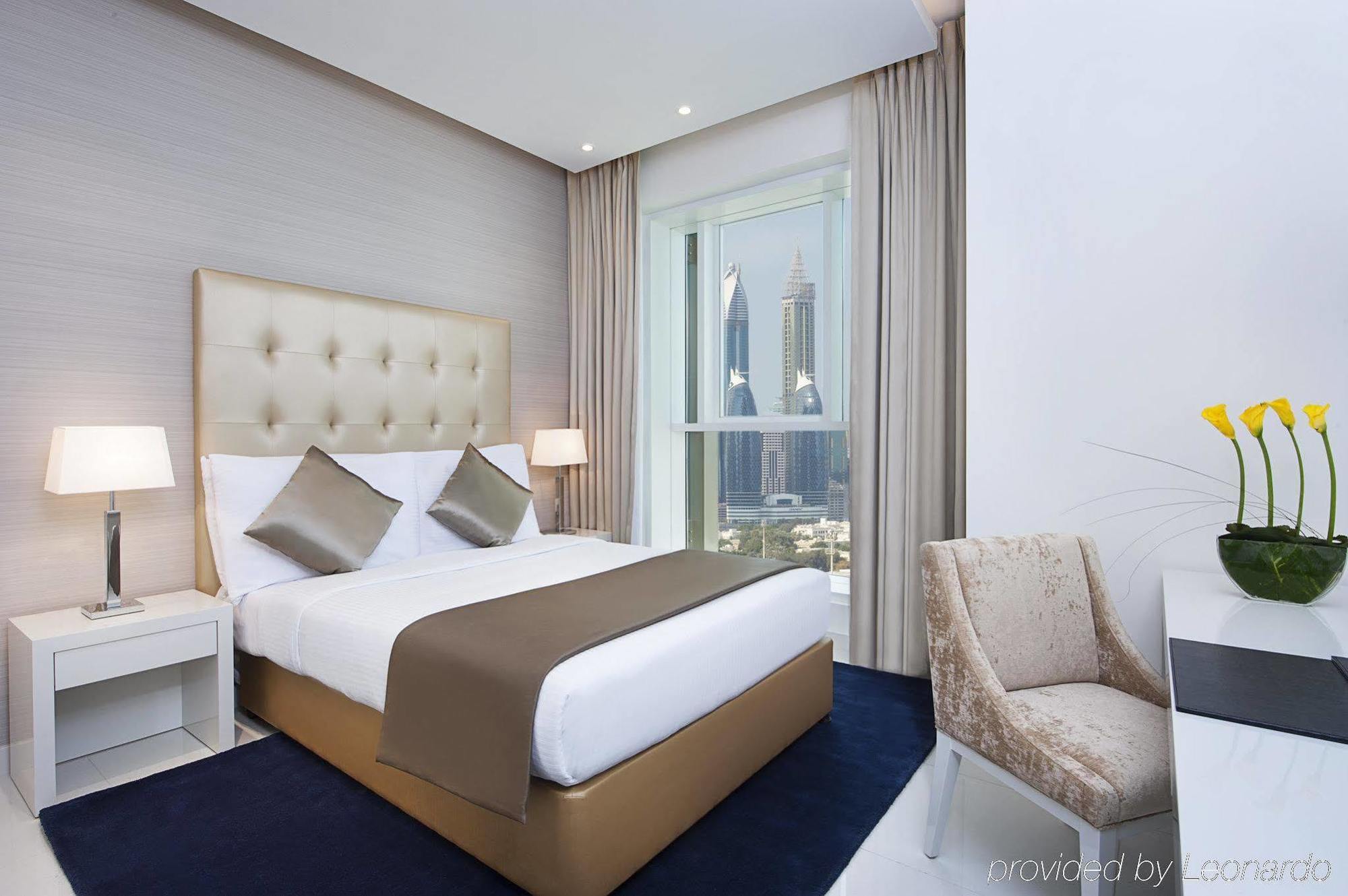 Damac Maison The Vogue Dubai Esterno foto A bedroom at the hotel
