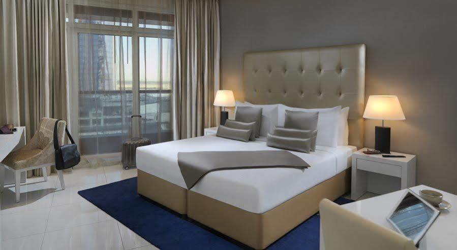 Damac Maison The Vogue Dubai Esterno foto A bedroom at the hotel
